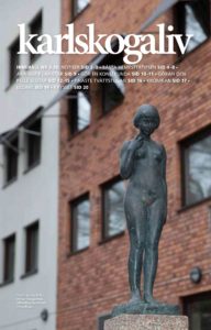 Omslag av kundtidningen karlskogaliv. Omslaget pryds av en bild på statyn "Eva" som finns i Karlskoga. I bakgrunden ett rött tegelhus.